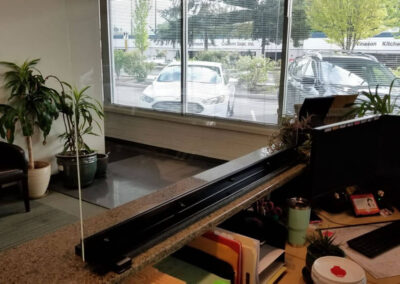 The view through the sneeze guard from the receptionist side is clear an unobstructed.